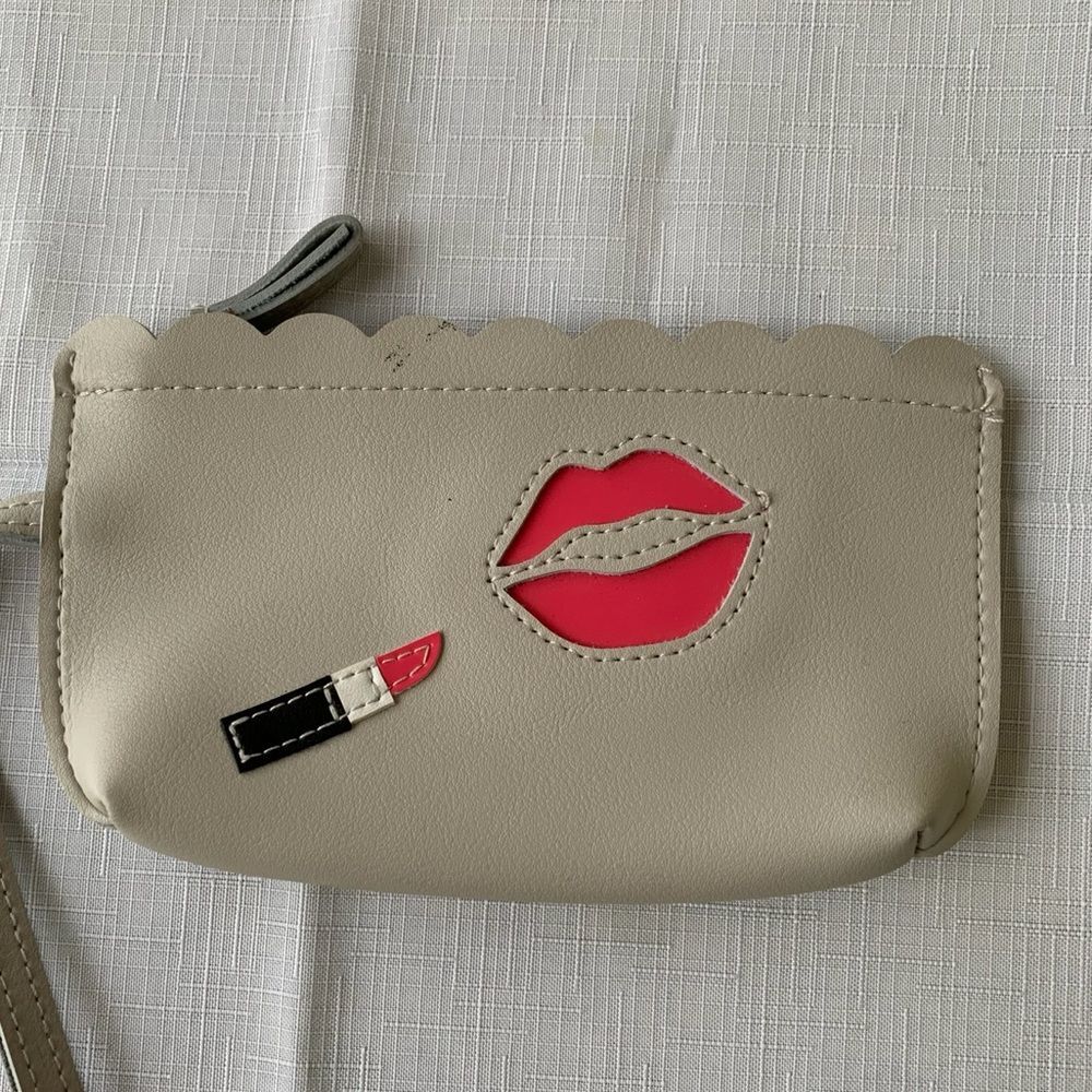 Bloomingdales light gray makeup bag, about  4x7 inches